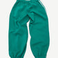 GV Gallery green scrunch sweatpants back view showing Raspberry Hills Lil Leon graphic and bunched hem.