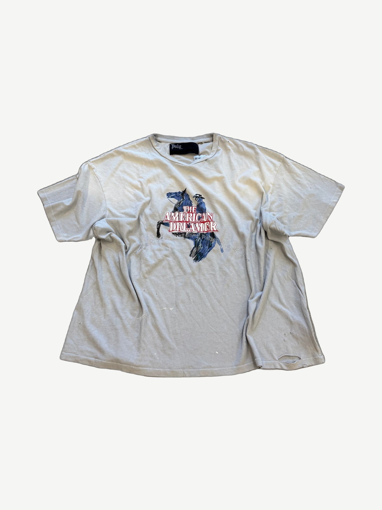 Paly Hollywood American Dreamer distressed cream tee with cowboy on rearing horse graphic and rhinestone trim