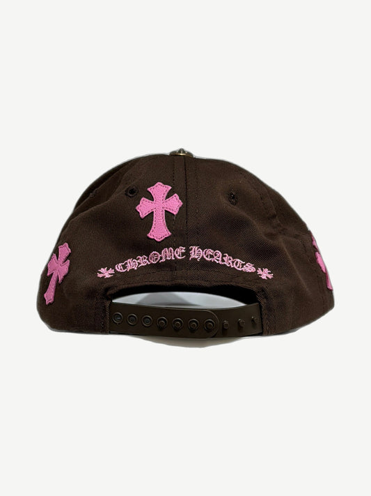 Chrome Hearts brown CH baseball cap side angle, curved brim and pink cross patch detail