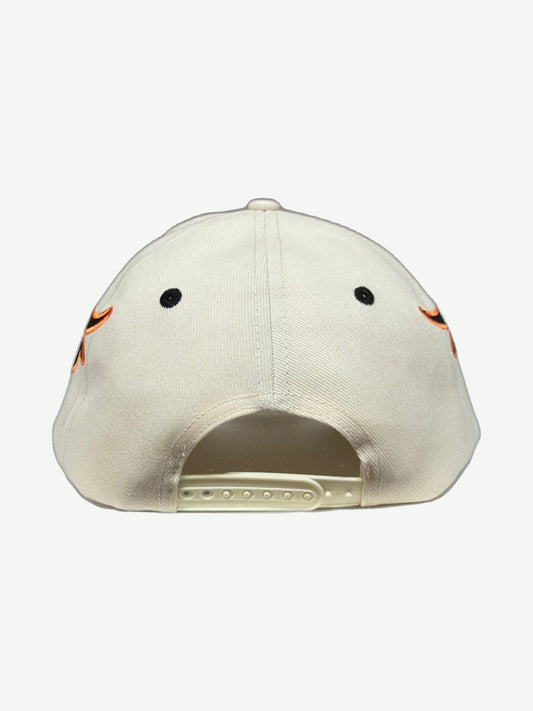 HMDD cream Memories snapback hat angled side view showing orange flame embroidery and curved brim.