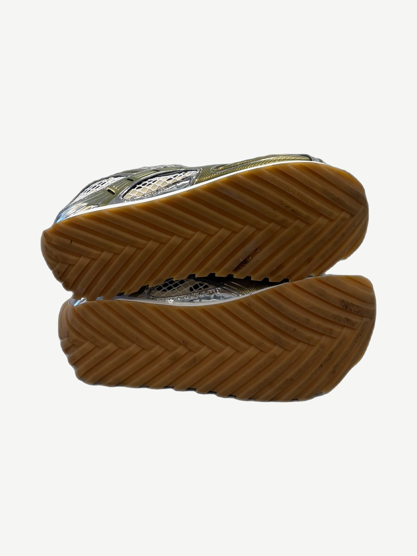 Bottega Veneta Orbit sneakers chevron gum rubber outsoles with embossed brand stamp on tan herringbone tread