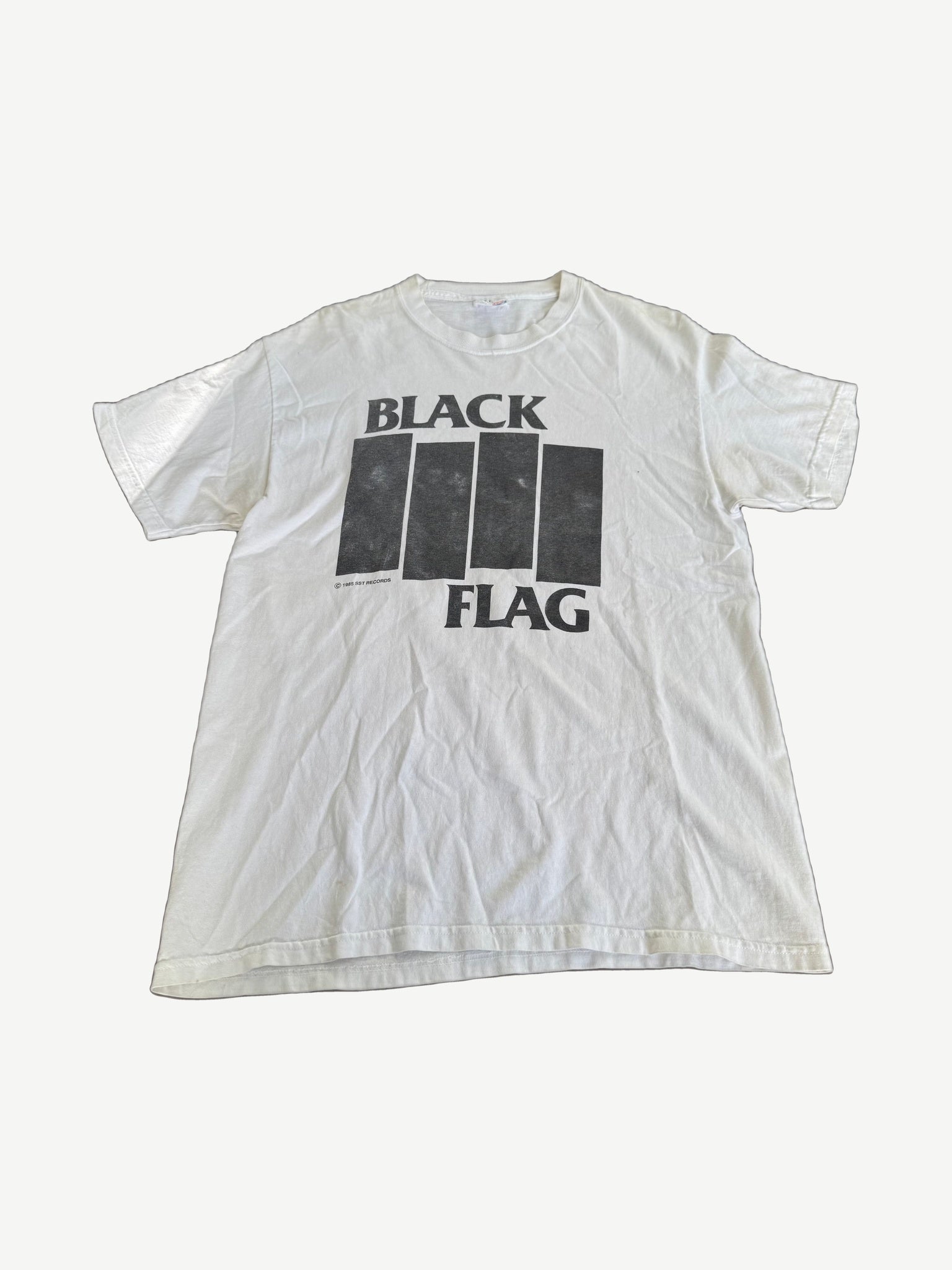 Vintage Black Flag band tee in faded white cotton with classic four black bars logo punk hardcore graphic