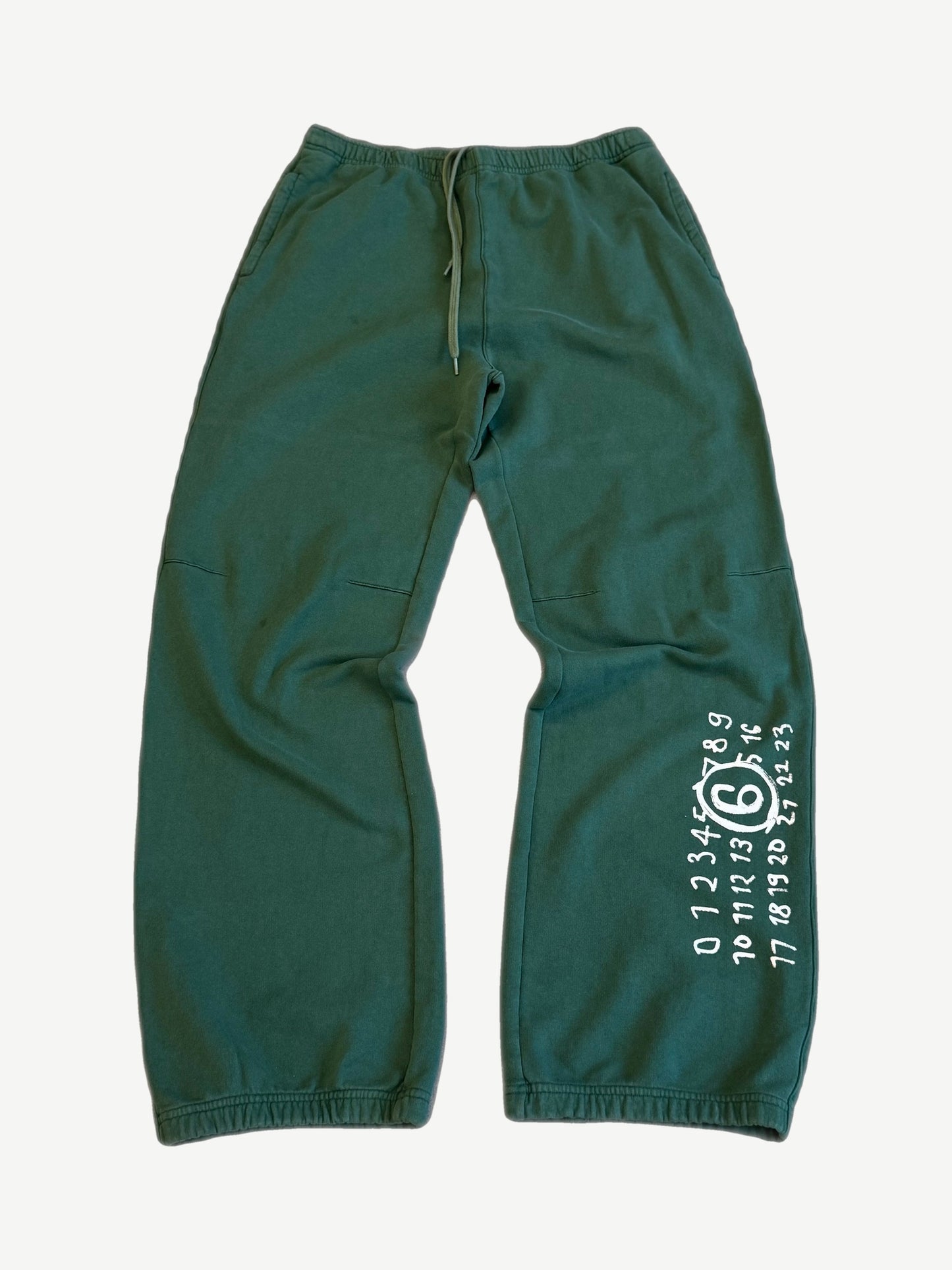 Maison Margiela MM6 forest green relaxed sweatpants with drawstring waist and white MM6 numerical logo print