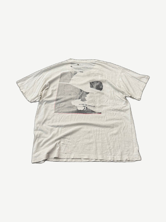 Vintage Marlboro Cowboy Adventure tee back view, distressed white cotton with faded grayscale cowboy graphic.