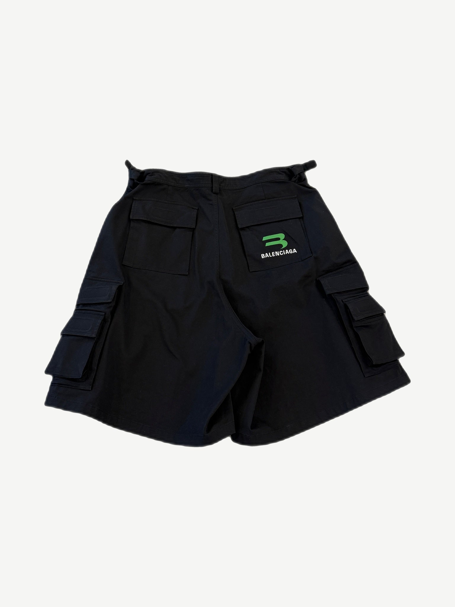 Balenciaga black gamer cargo shorts back view with green Balenciaga B logo on rear pocket and side cargo pockets