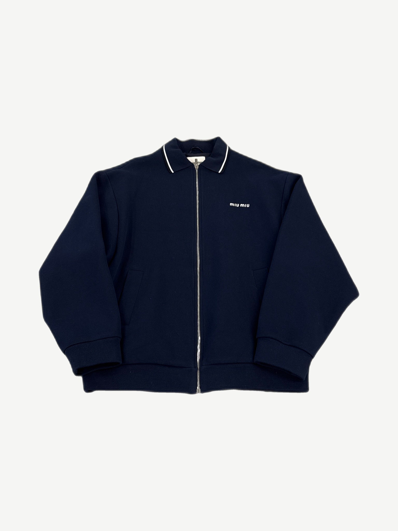 Miu Miu navy piquet blend blouson zip jacket with white-tipped collar and small miu miu chest logo.