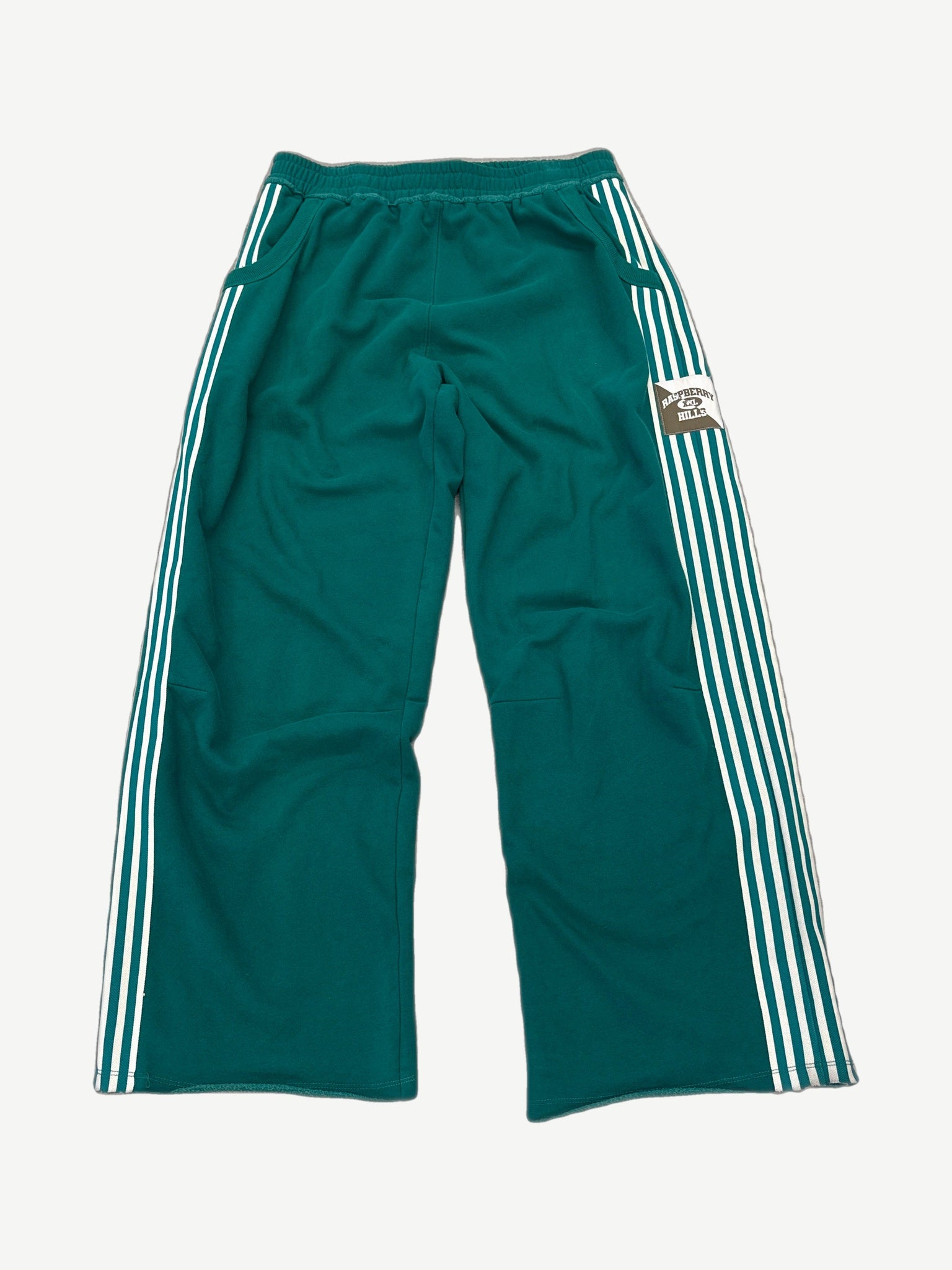 GV Gallery Raspberry Hills Lil Leon green cotton sweatpants with drawstring waist and embroidered leg graphic.
