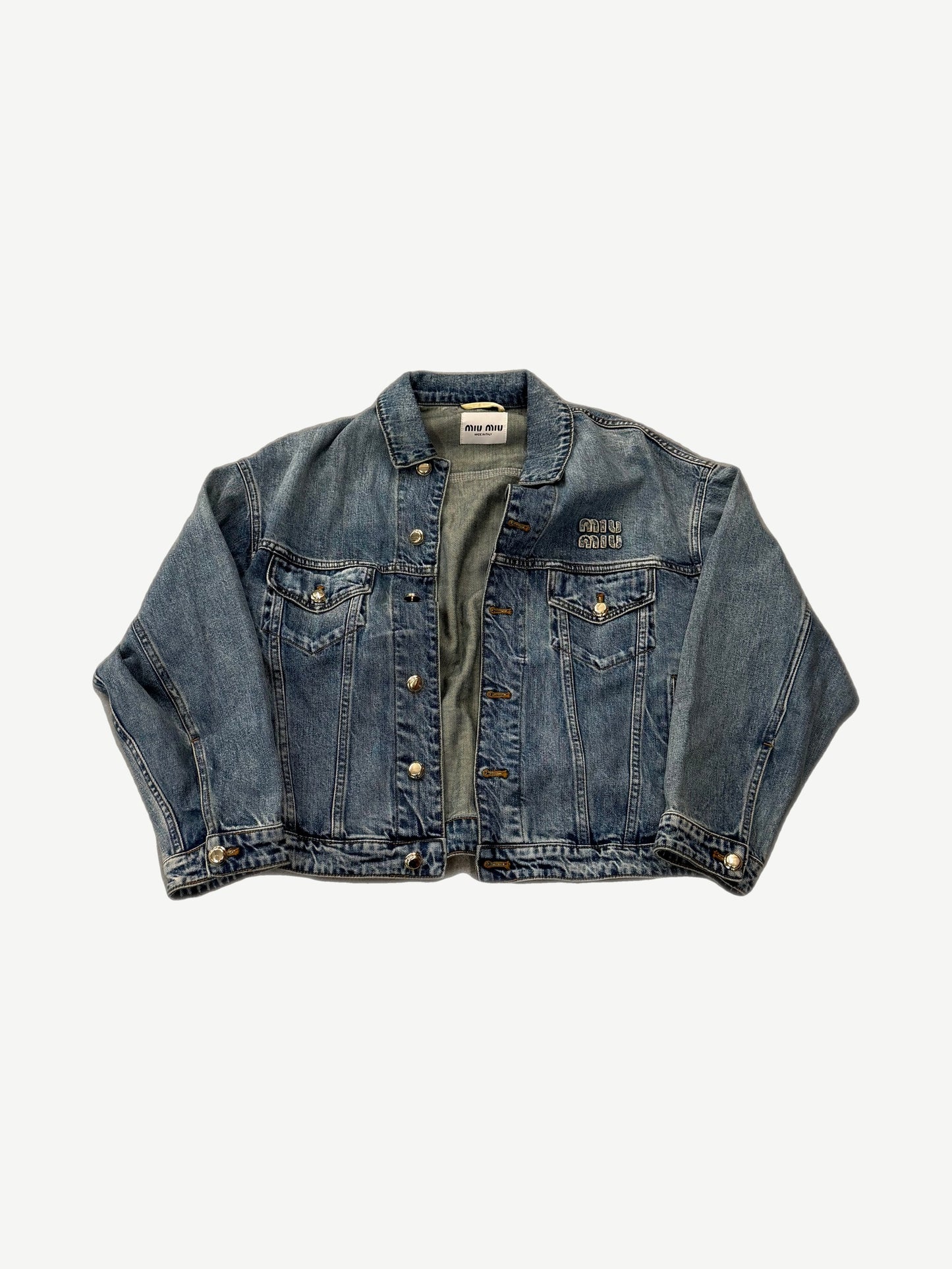 Miu Miu washed blue cropped denim jacket open front with chest pocket embroidery and gold buttons.
