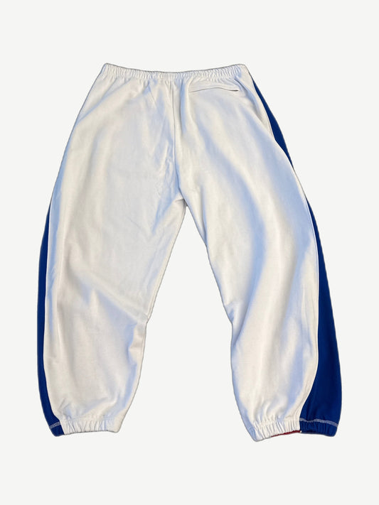 Hidden Season white athletic sweatpants back view with blue side panels and elastic cuffed ankles