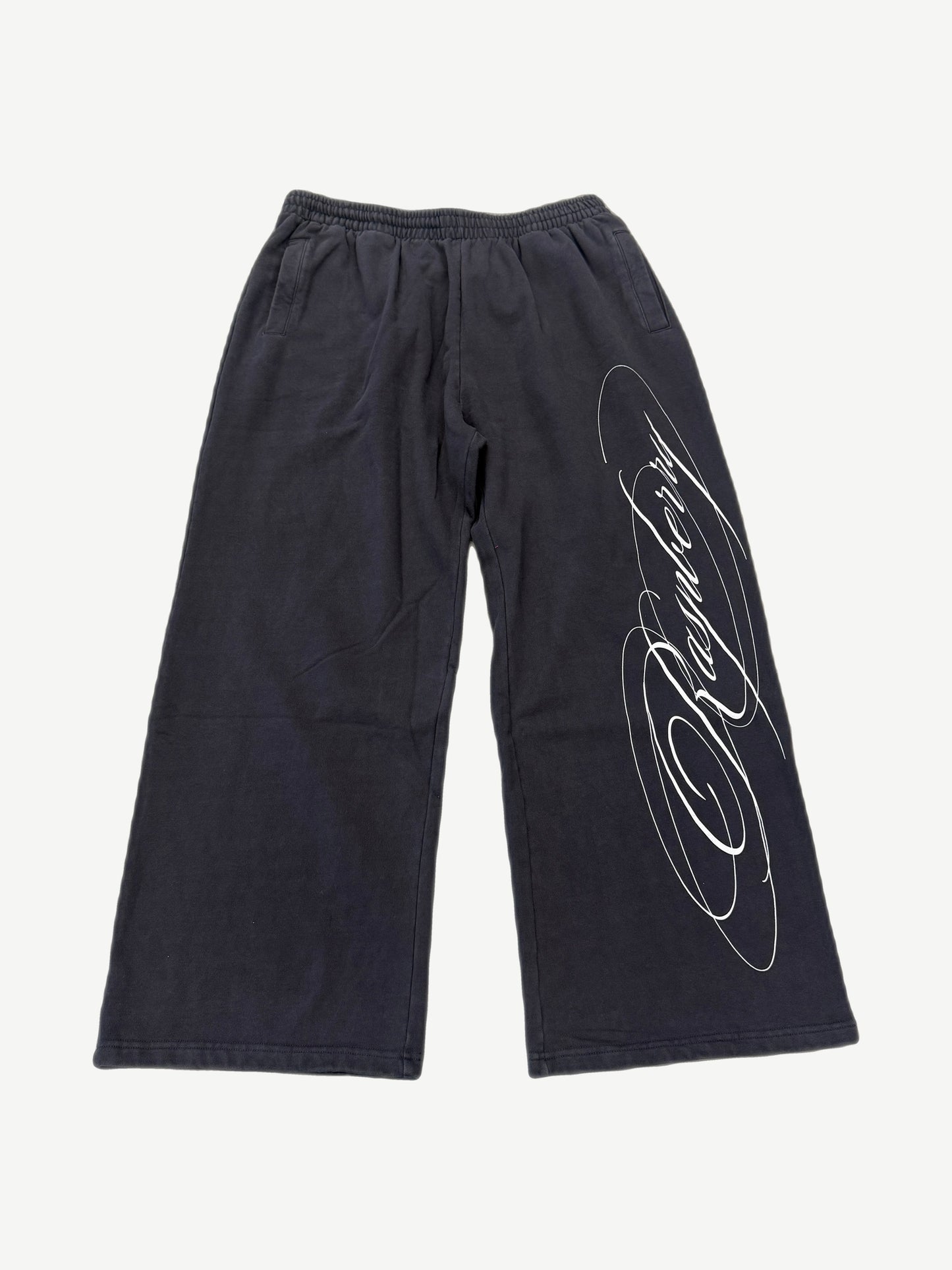 GV Gallery x Raspberry Hills black wide-leg sweatpants with white cursive script logo down leg.