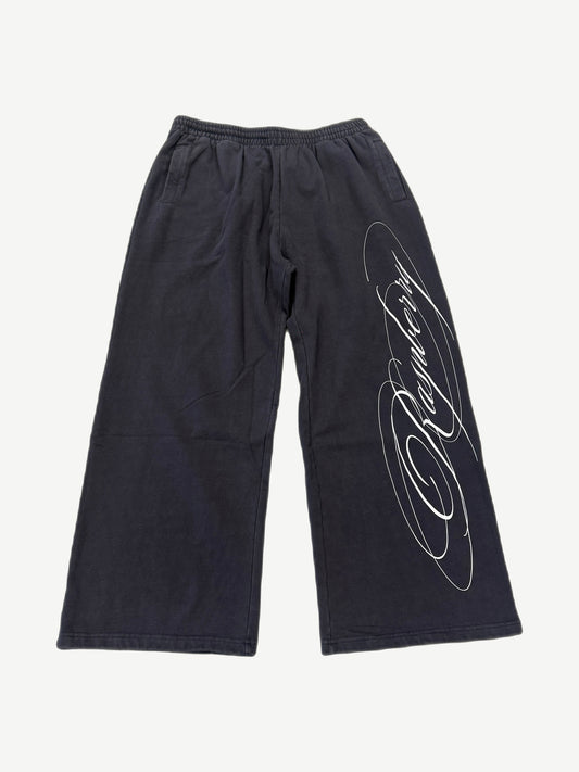 GV Gallery x Raspberry Hills black wide-leg sweatpants with white cursive script logo down leg.
