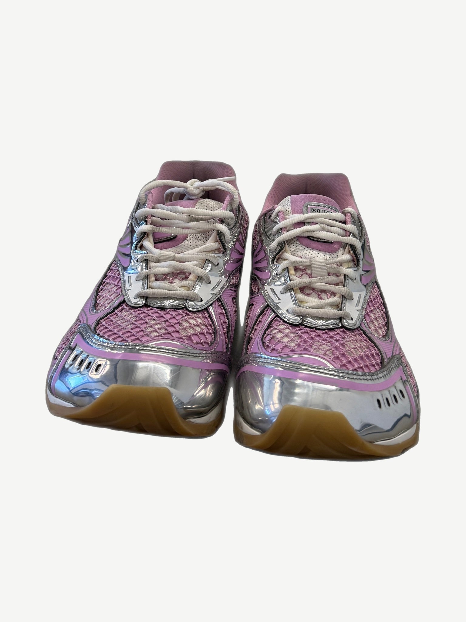 Bottega Veneta Orbit pink sneakers front pair with chrome toe caps and Bottega Veneta side branding