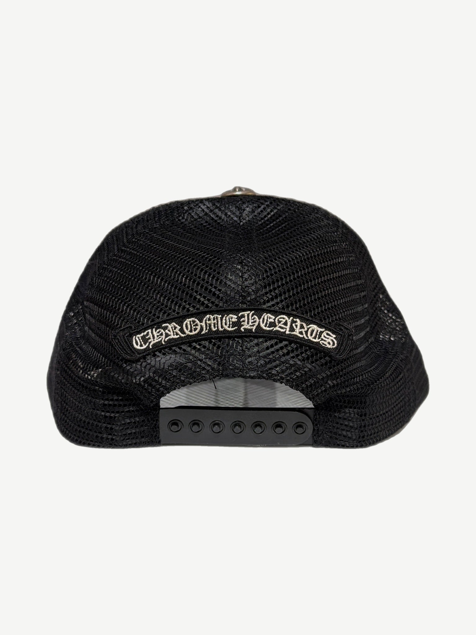 Chrome Hearts Cemetery trucker hat with multicolor cross patches scattered across black crown.