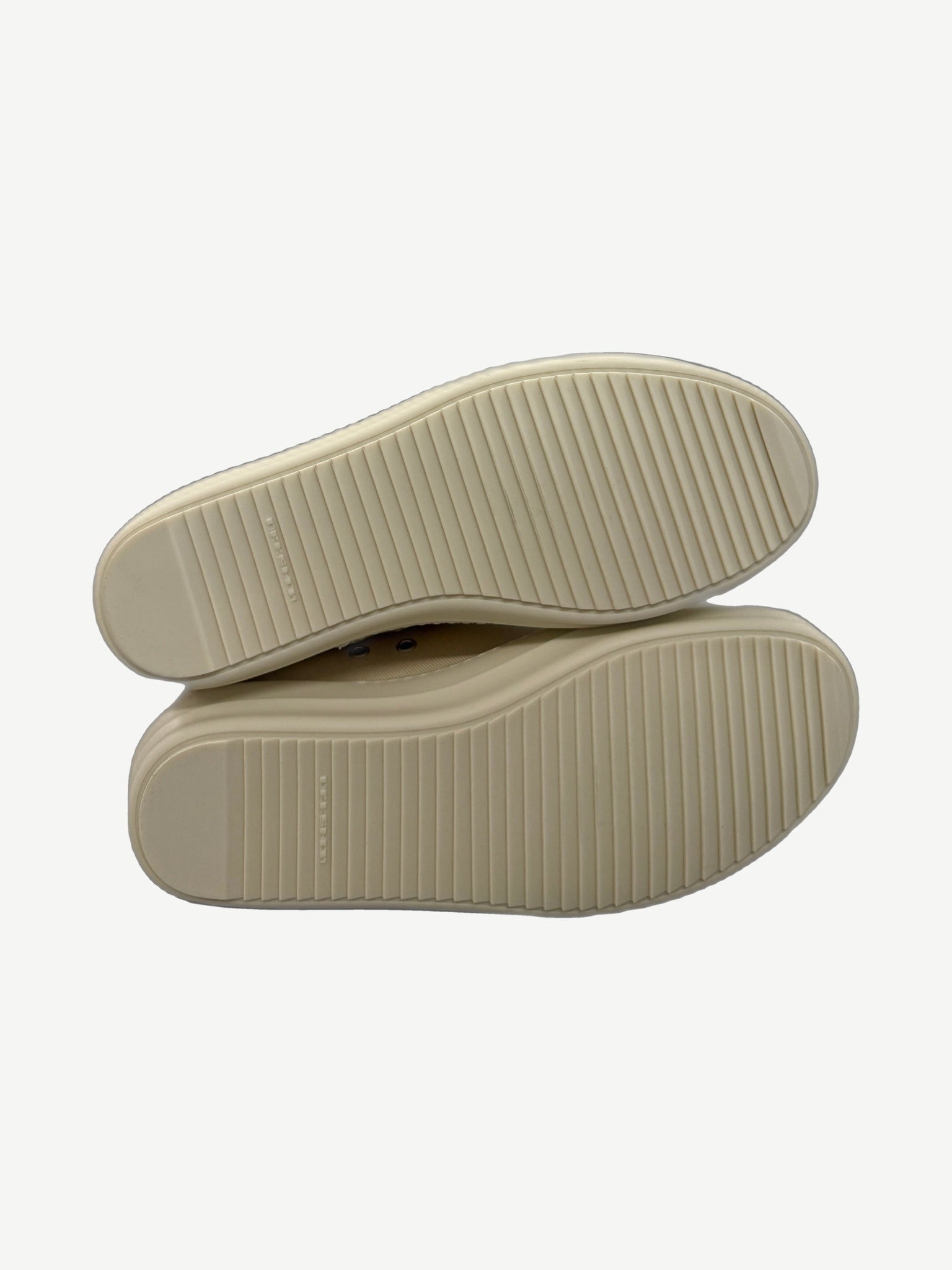 Sole detail of Rick Owens DRKSHDW Jumbo Lace sneakers showing ribbed milk rubber outsole tread pattern