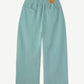HMDD seafoam green organic sweatpants back view showing patch pocket and tapered cuffed leg silhouette
