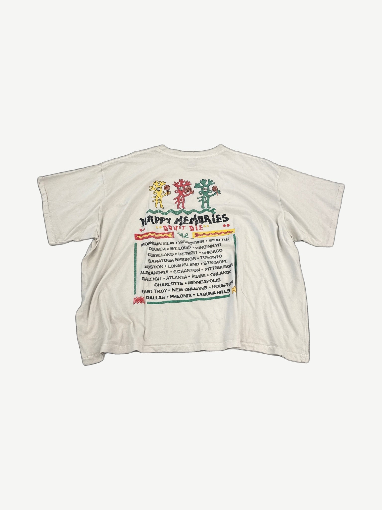 HMDD cream Rasta festival tee back view, faded vintage Rasta-colored back print on natural cotton body.