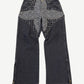 Louis Vuitton gray denim jeans front view with monogram flower star patchwork panel and ankle zippers