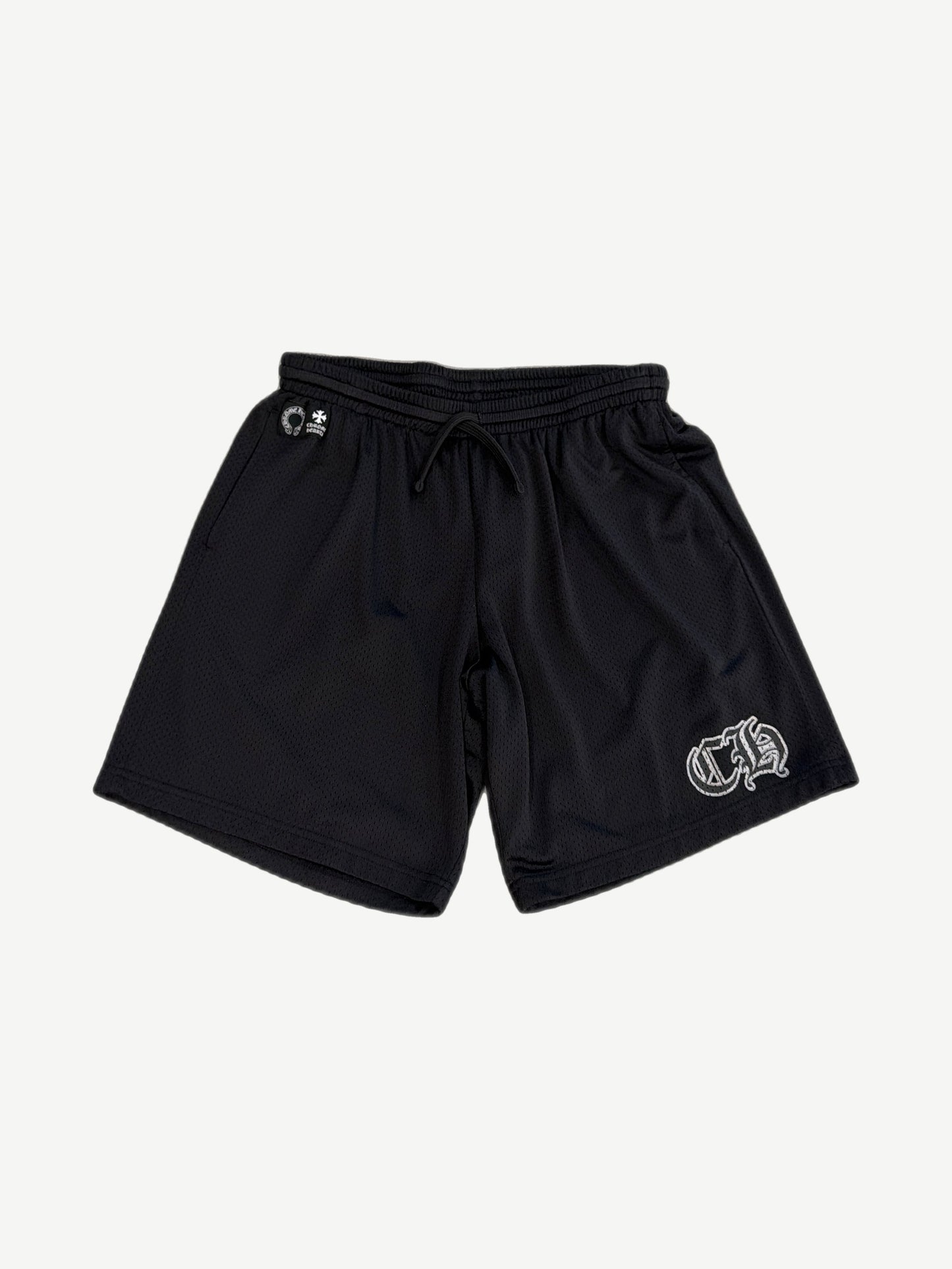 Chrome Hearts black mesh shorts front view with drawstring waist, horseshoe and cross logos, white gothic CH on left leg.