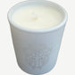 Chrome Hearts scented candle close up showing white ceramic vessel with engraved dagger crest motif.