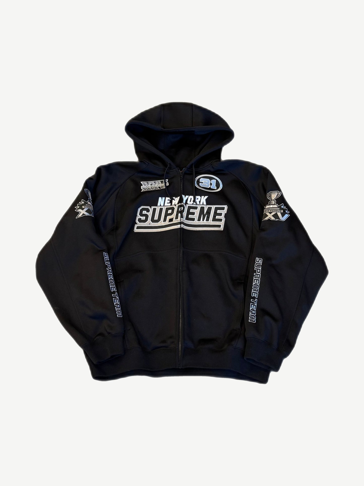 Supreme black football zip up hooded sweatshirt front view with chest patches and contrast trim.