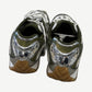 Bottega Veneta Orbit sneakers heel view showing chrome silver heel counters with olive mesh panels