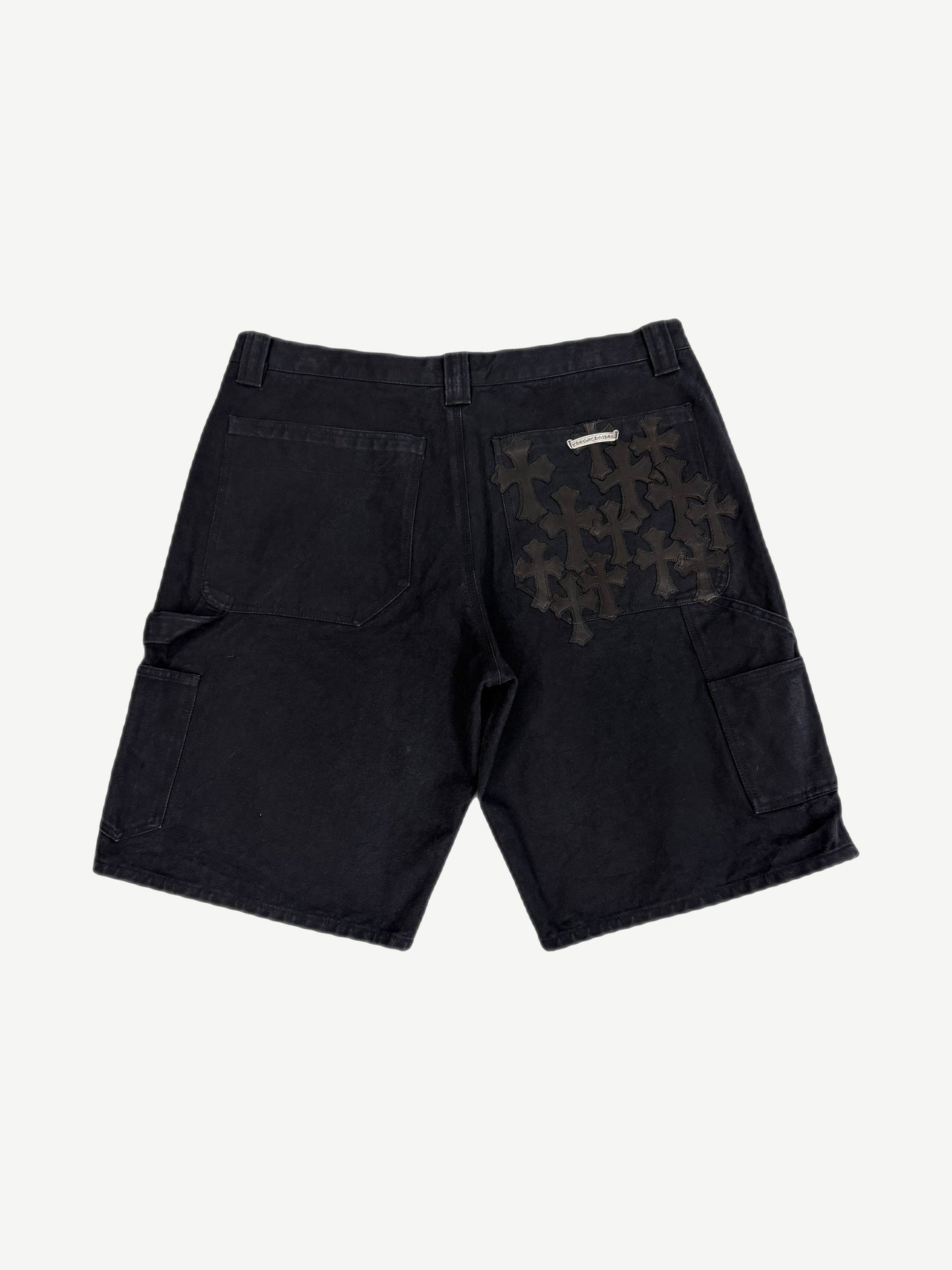 Chrome Hearts black carpenter shorts back view flooded with black leather cross patches on right pocket and panel