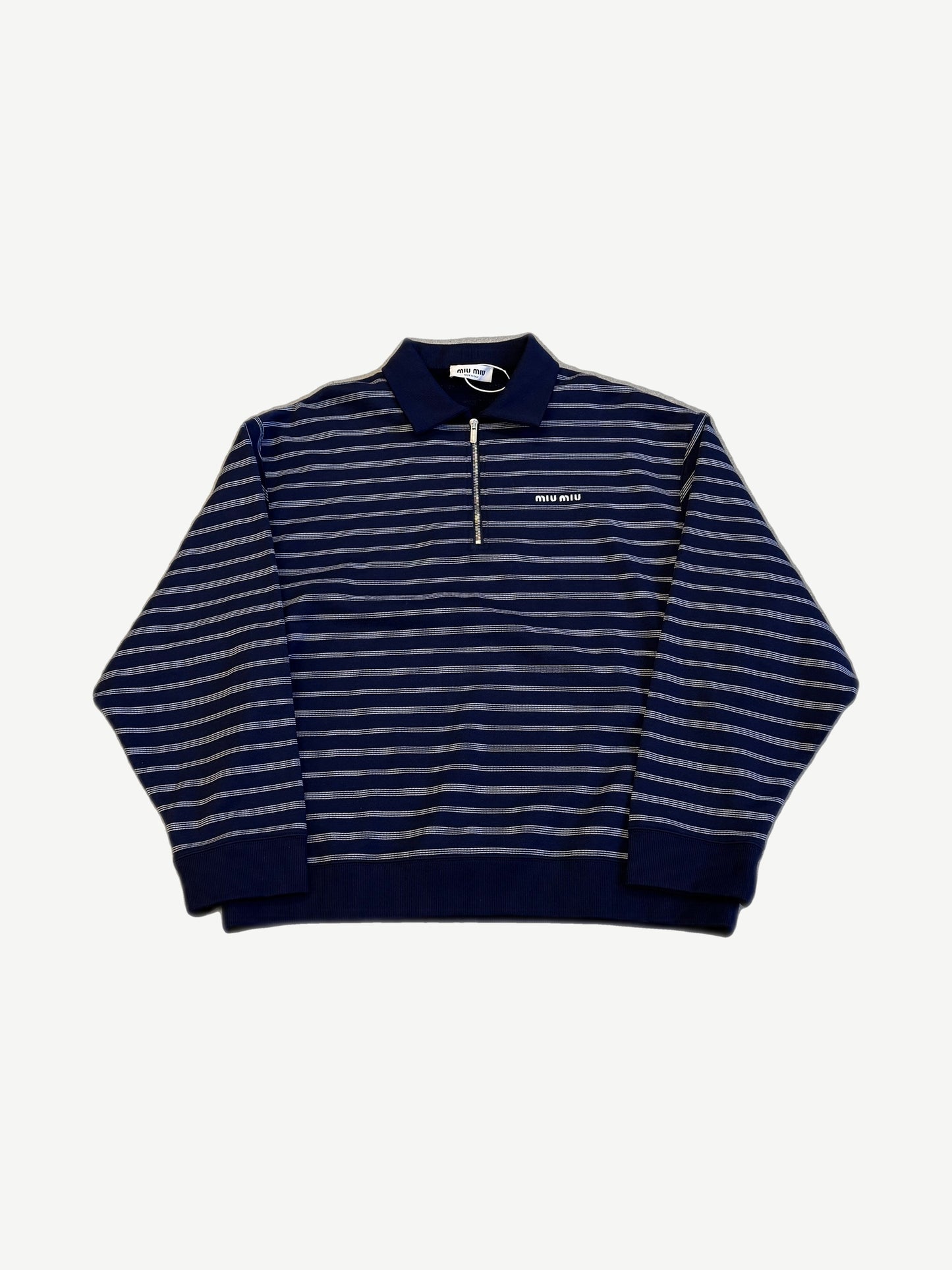 Miu Miu navy and white striped halfzip polo sweatshirt with embroidered Miu Miu logo on the chest.
