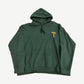 Chrome Hearts green T-Bar hoodie with orange Chrome Hearts horseshoe chest emblem and cross sleeve graphics.