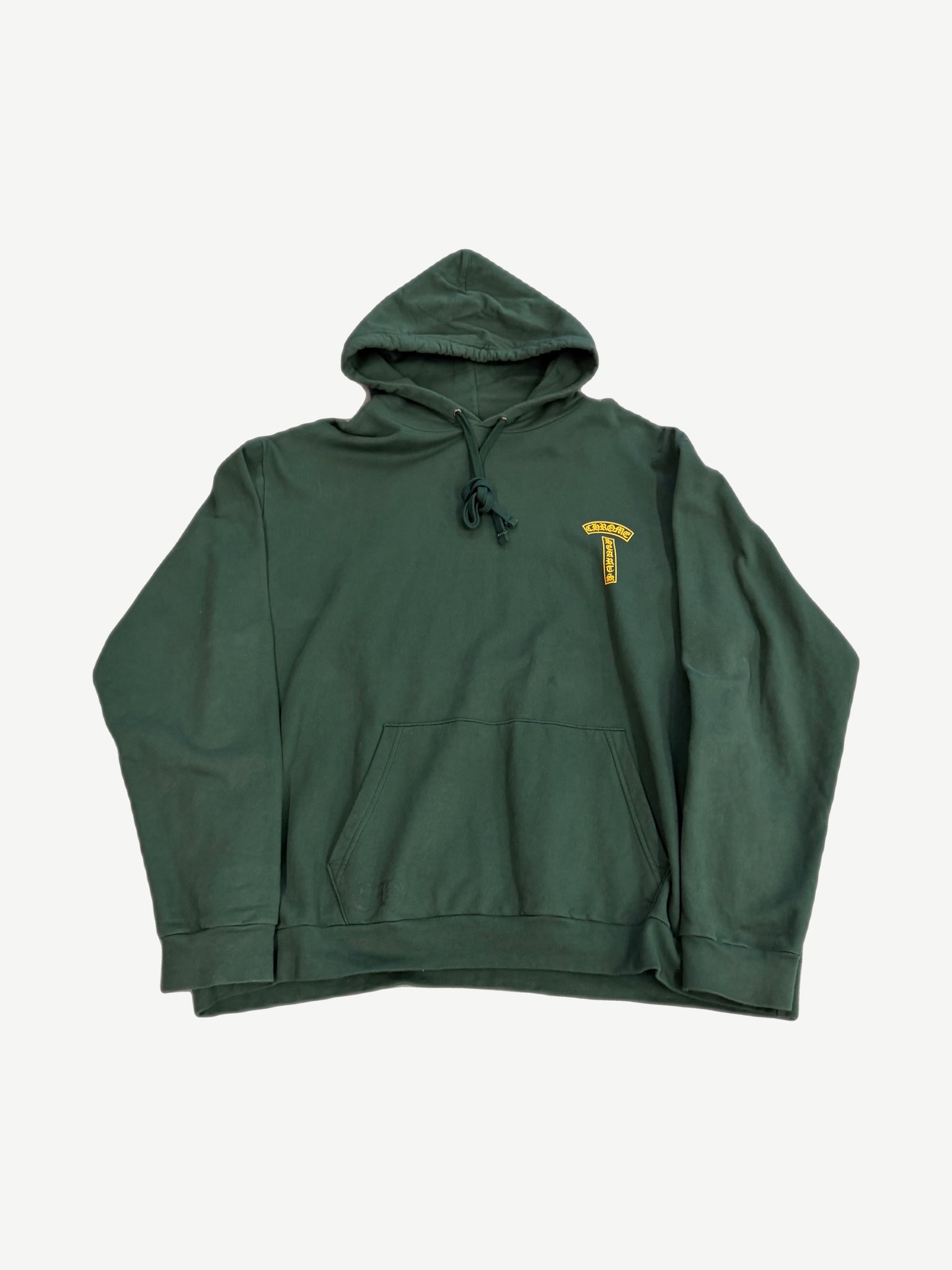 Chrome Hearts green T-Bar hoodie with orange Chrome Hearts horseshoe chest emblem and cross sleeve graphics.
