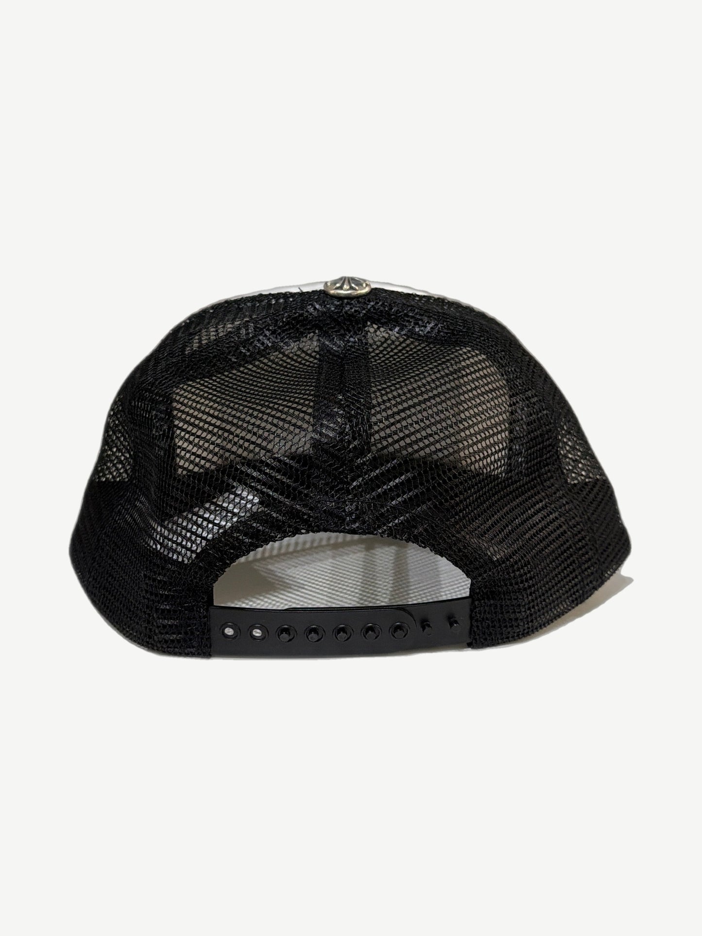 Chrome Hearts trucker hat rear view with black mesh paneling, snapback closure and silver cross top button