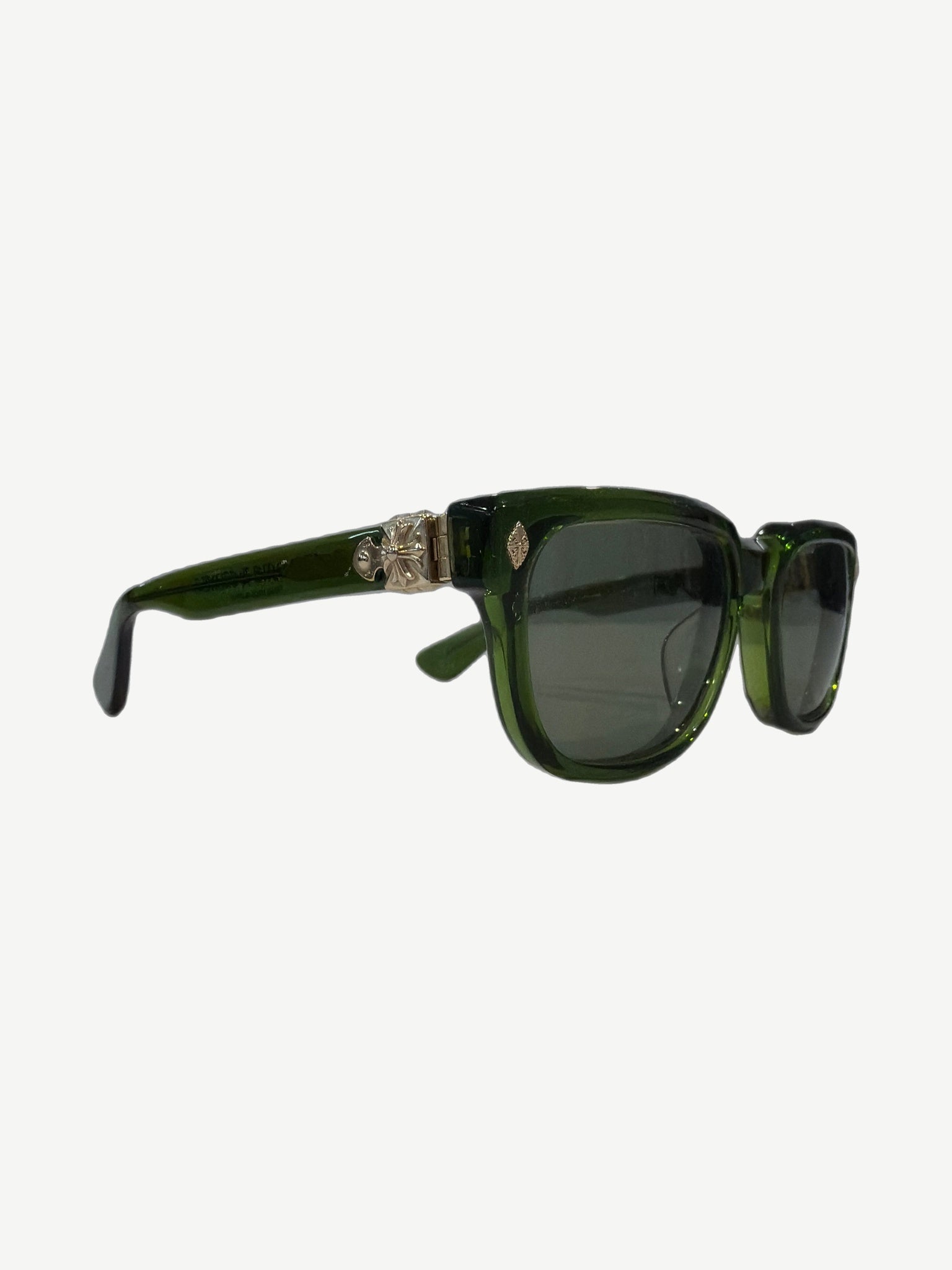Chrome Hearts Sitonit sunglasses side profile with translucent green acetate frame and silver cross temple hinge