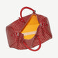Goyard Red Boston 50 duffle bag open top showing yellow Goyard branded interior lining and red leather trim