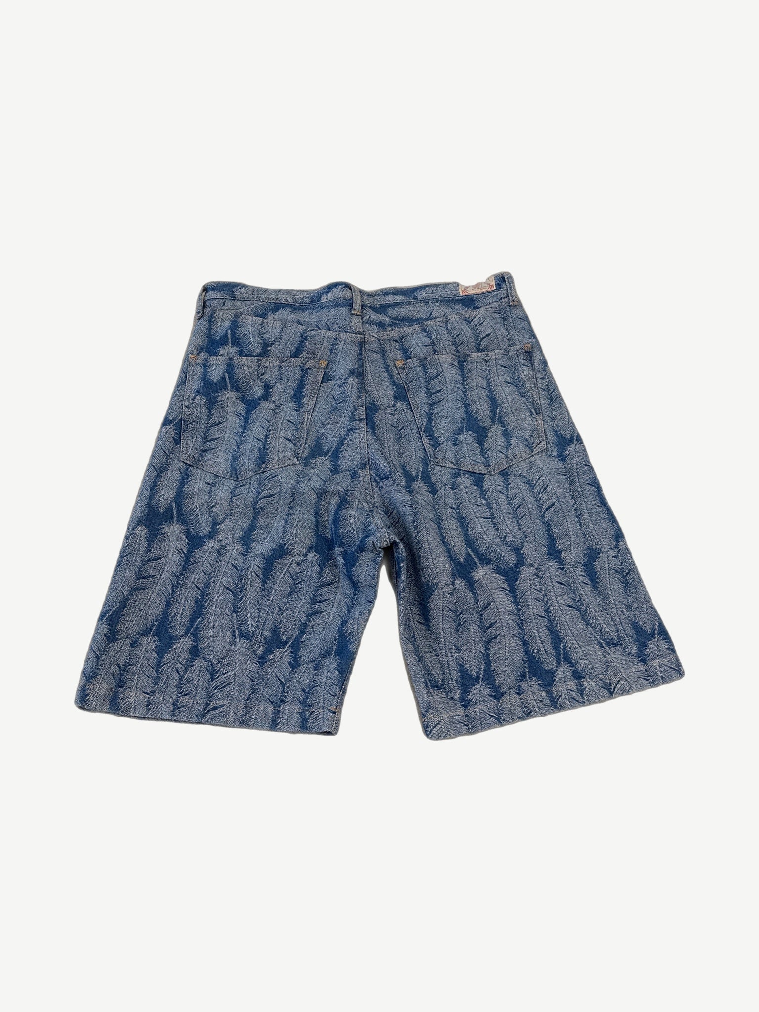 Kapital blue feather magpie denim shorts back showing woven feather pattern and rear waistband label.