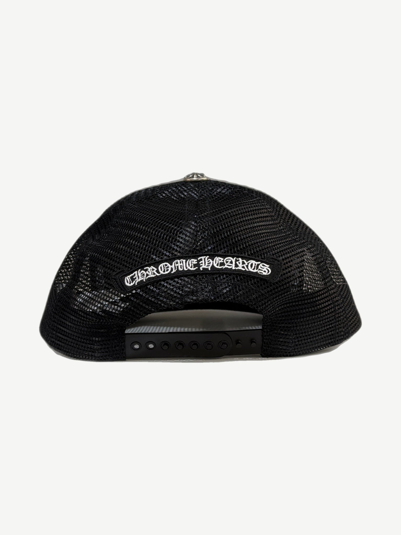 Chrome Hearts black trucker hat back showing white embroidered gothic logo banner and snapback closure