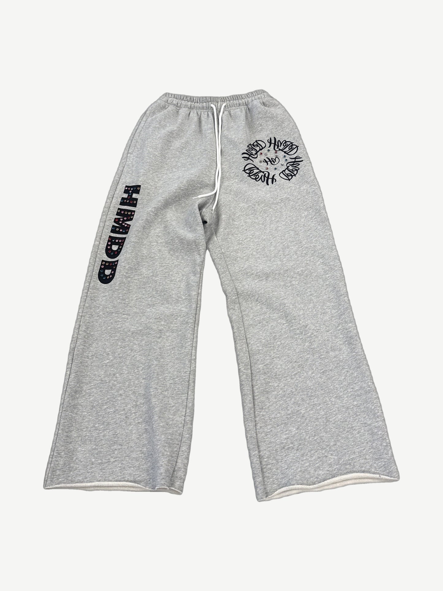 HMDD gray sweatpants with studded HMDD leg graphic and clustered circular logo emblems down the thigh.