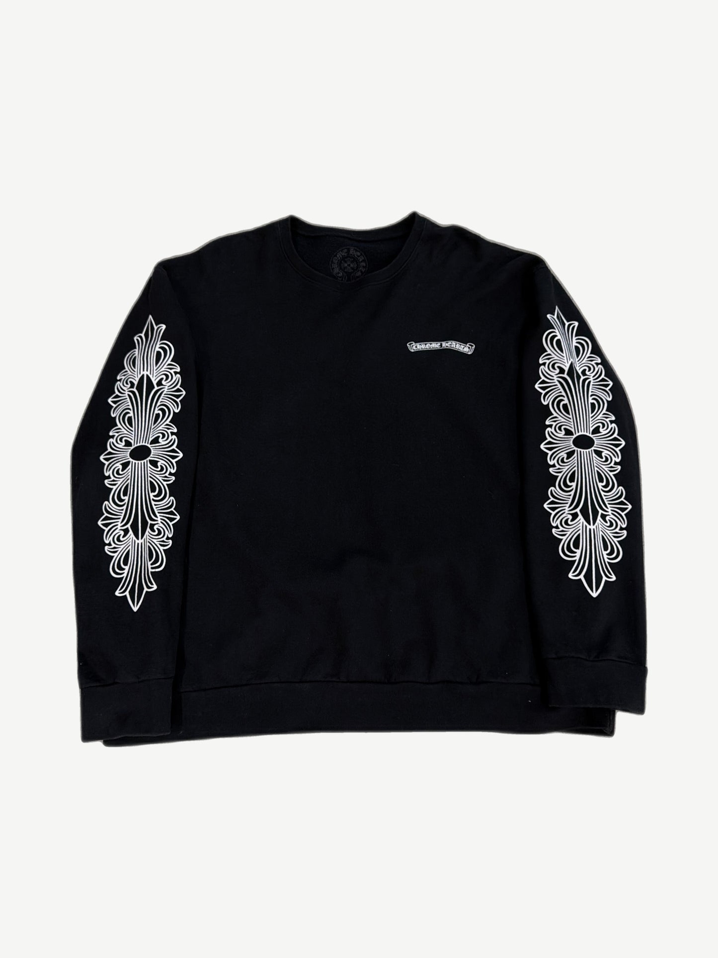 Chrome Hearts black crewneck front, purple dagger and floral graphics layered with eyechart text