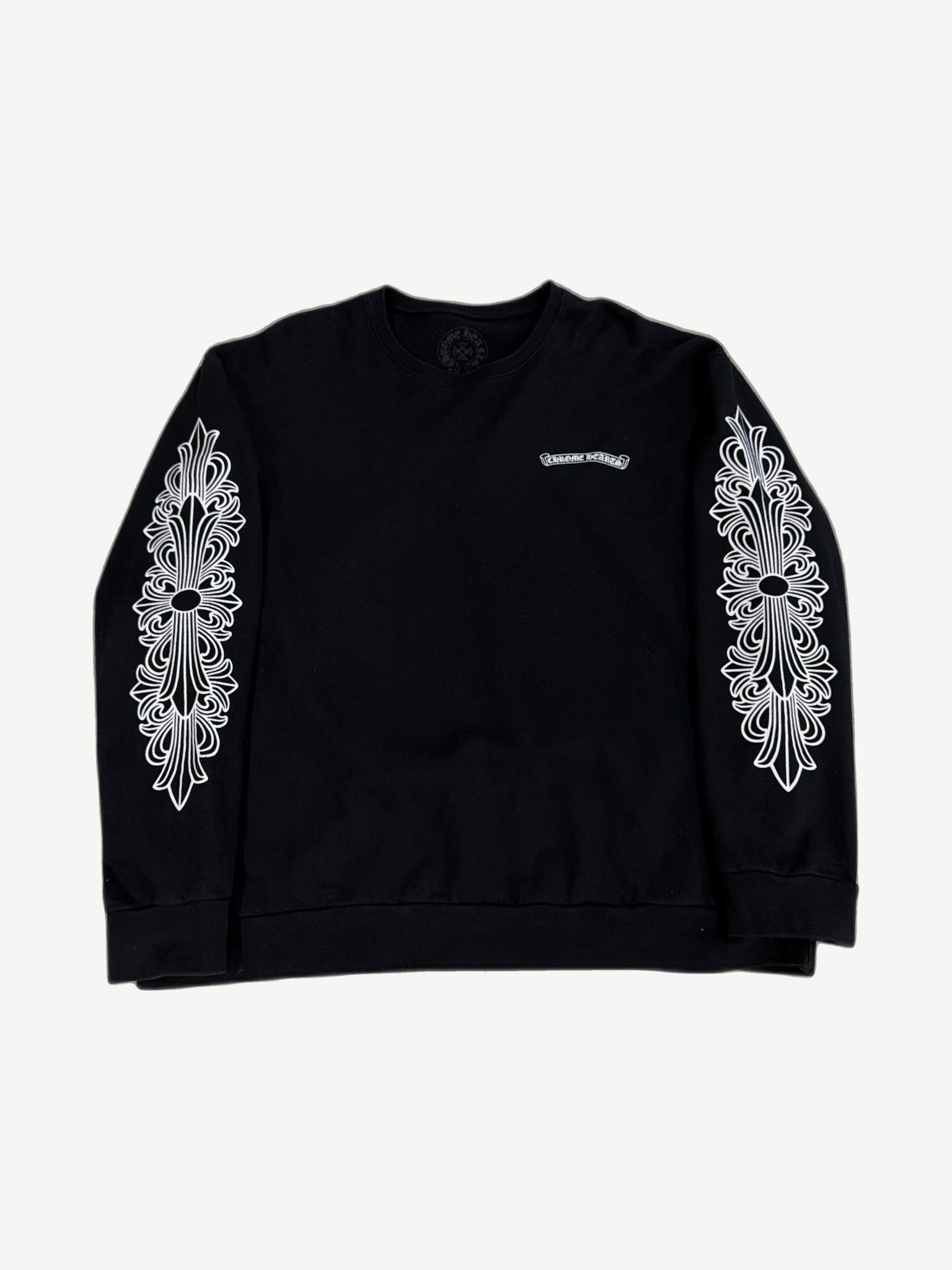 Chrome Hearts black crewneck front, purple dagger and floral graphics layered with eyechart text