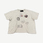 Paly Hollywood signature tee in distressed white with mixed cartoon doodles, Mickey and Mastery prints.
