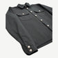 Chrome Hearts Work Dog jacket angled view showing black twill, dual chest pockets and silver cross snap buttons.