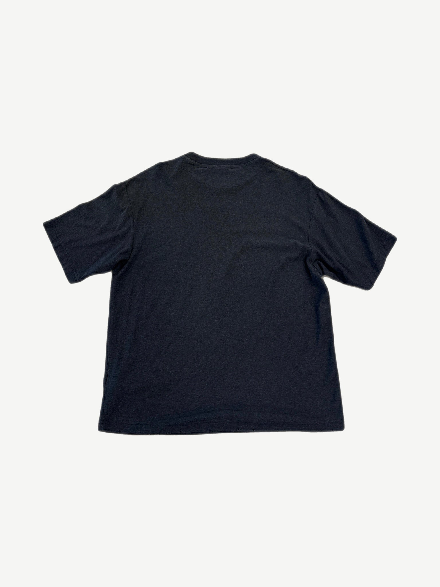 Back view of Acne Studios plain black short sleeve t-shirt with relaxed boxy fit and no rear graphics.