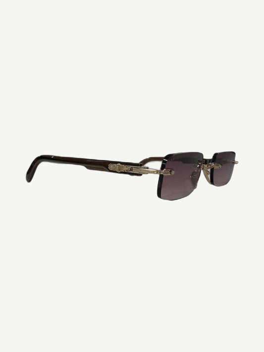 Chrome Hearts Wood Deep 1 rimless sunglasses side view with brown horn temples and engraved gold scroll arms