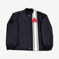 Chrome Hearts black nylon racing jacket with white leather stripes and red leather triple cross patch