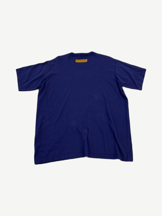 Louis Vuitton blue script logo tee back view showing solid royal blue cotton jersey and clean hem.
