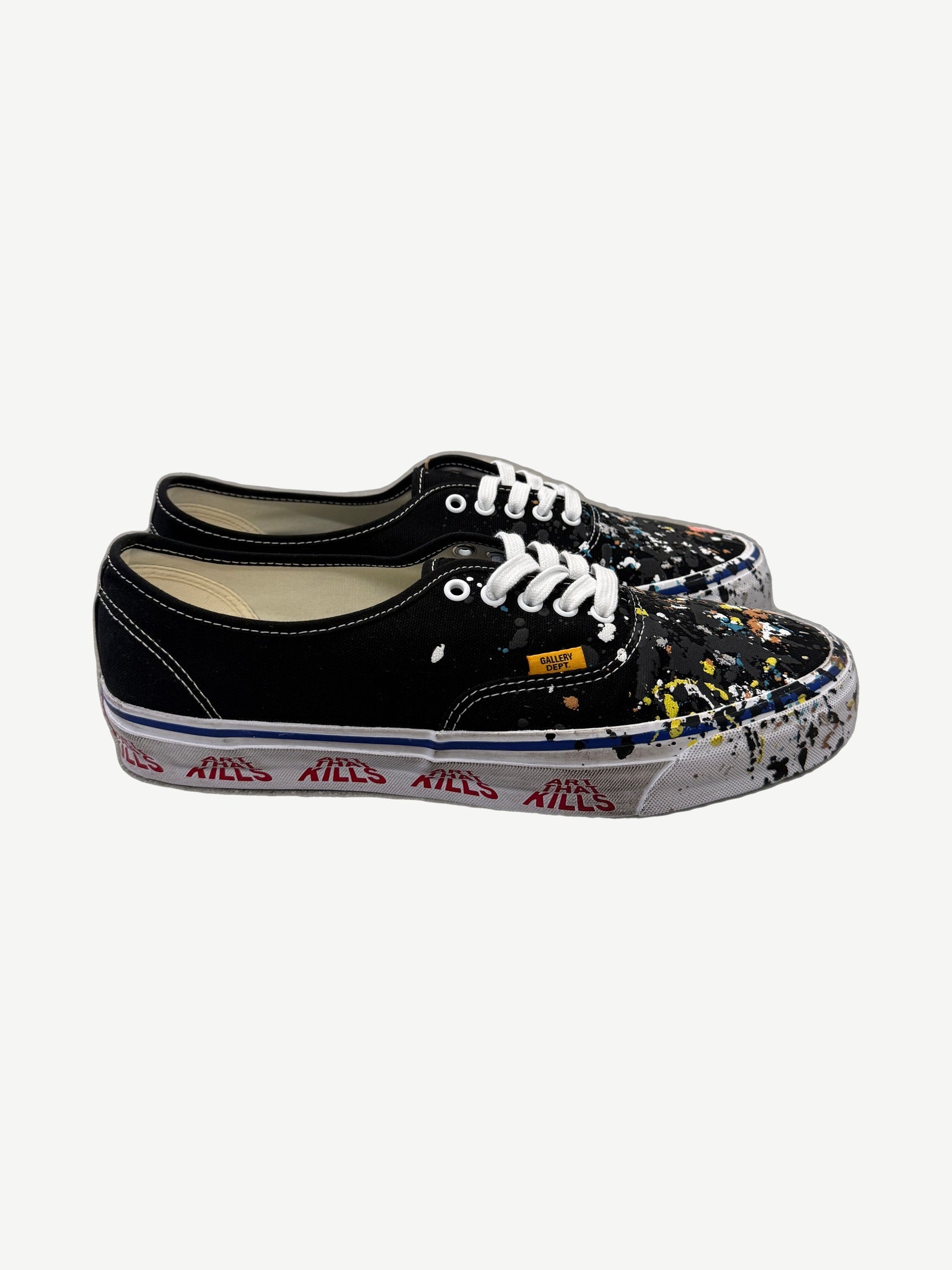 Gallery Dept Art That Kills black Vans Authentic sneakers with paint-splattered toe and red foxing print.