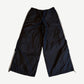 Happy Memories Don't Die HMDD black trackpants back view with white piping and zipped ankle gussets.