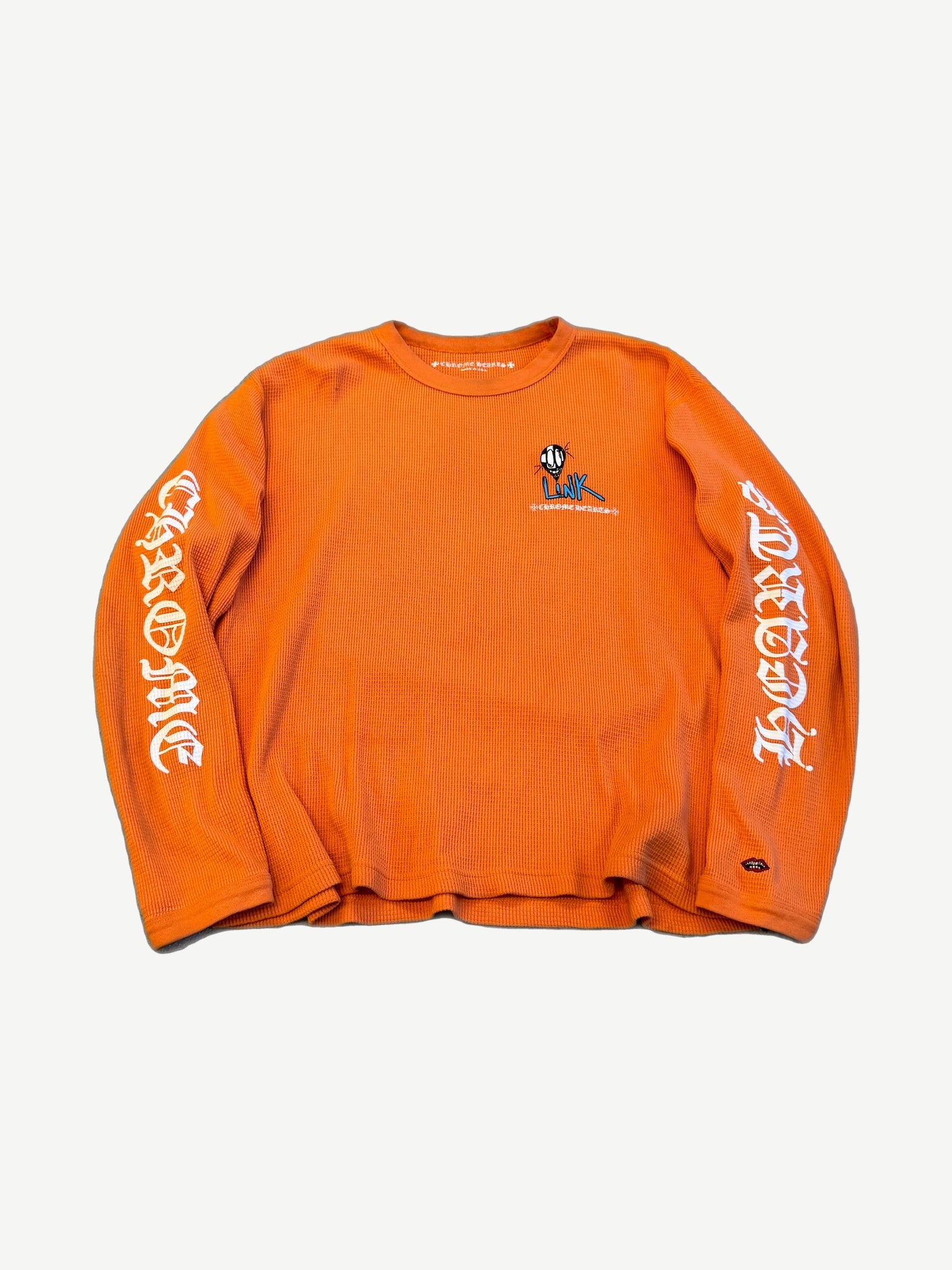 Chrome Hearts Matty Boy orange waffle thermal longsleeve with LINK smiley chest and gothic sleeve print