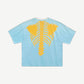 Kapital Bone 2 Tone tee back showing light blue body with bold yellow skeleton ribcage and spine graphic.