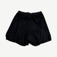 Rick Owens black suede wide-leg shorts back view with elastic waistband and curved hem