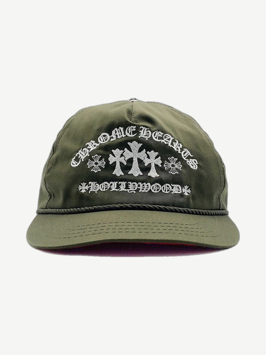 Chrome Hearts olive green trucker hat with embroidered triple cross logo and Gas Station graphic patch.