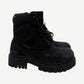 Balenciaga Combat Strike boots in chunky black canvas with lace-up military-style upper and exaggerated lugged sole.